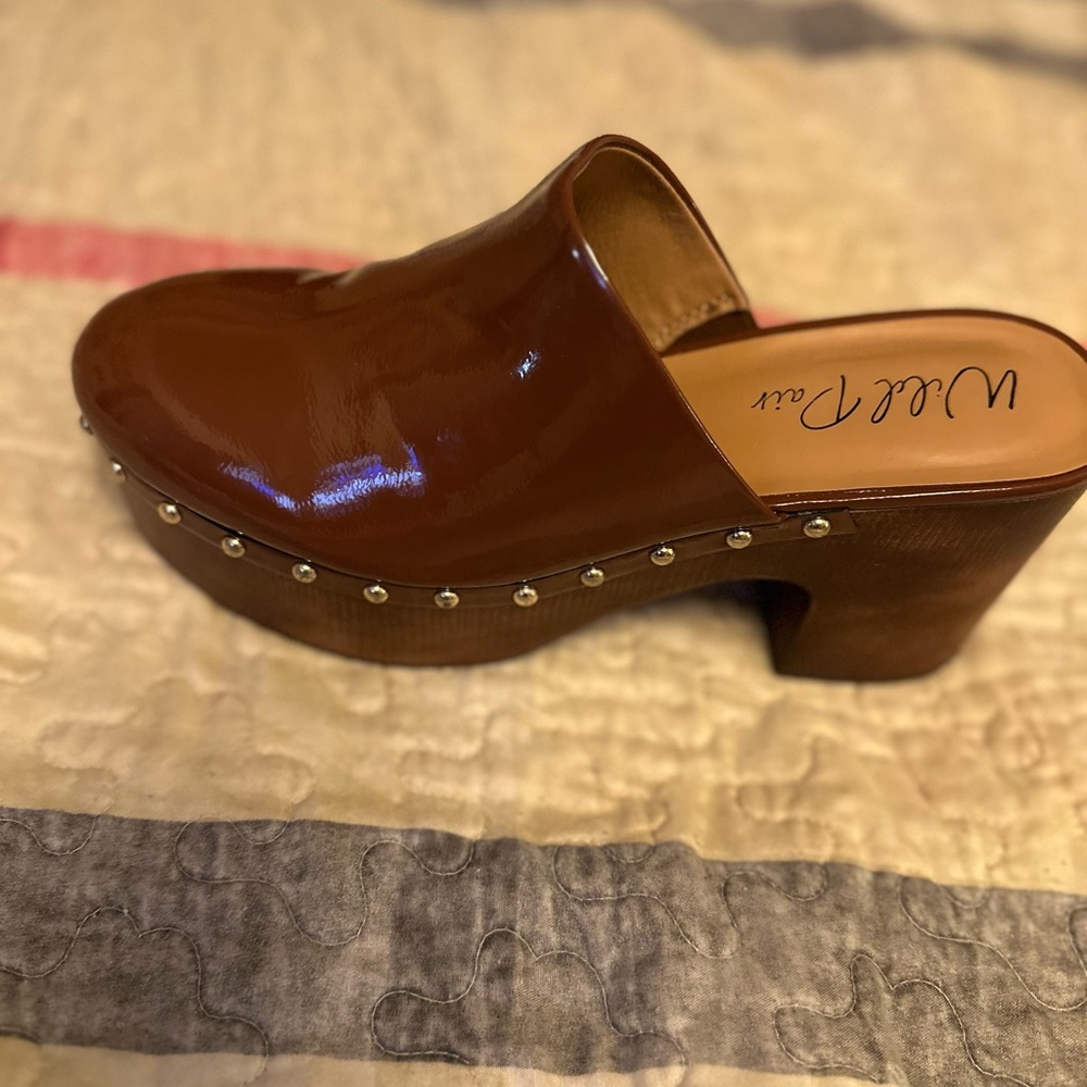 Brown wedge patent leather mules, wore once. No box.